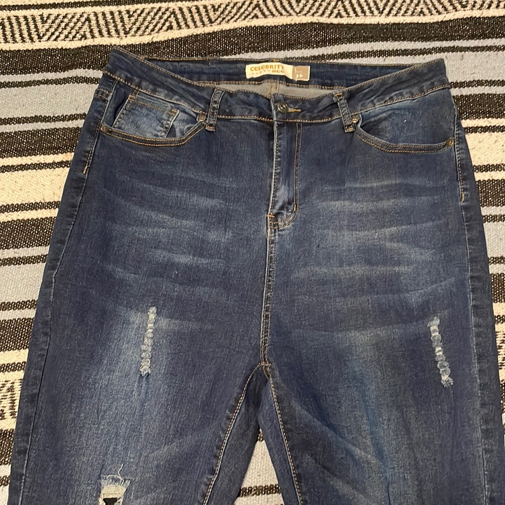 Sky high waisted distressed denim jeans
